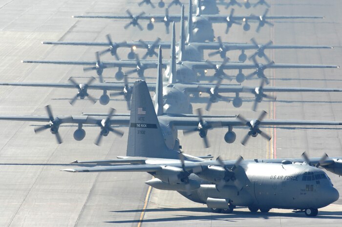 Multiple C-130's taxi in at Nellis Air Force Base Nev., Nov. 20, 2007 after completing airdrop missions during the Mobility Air Forces exercise over the Keno range in Nevada. The exercise is the first one hosted by the 57th Wing, which included approximately 15 C-130 Hercules and 15 C-17 Globemaster III from across the nation. (U.S. Air Force photo by Staff Sgt. Scottie McCord)