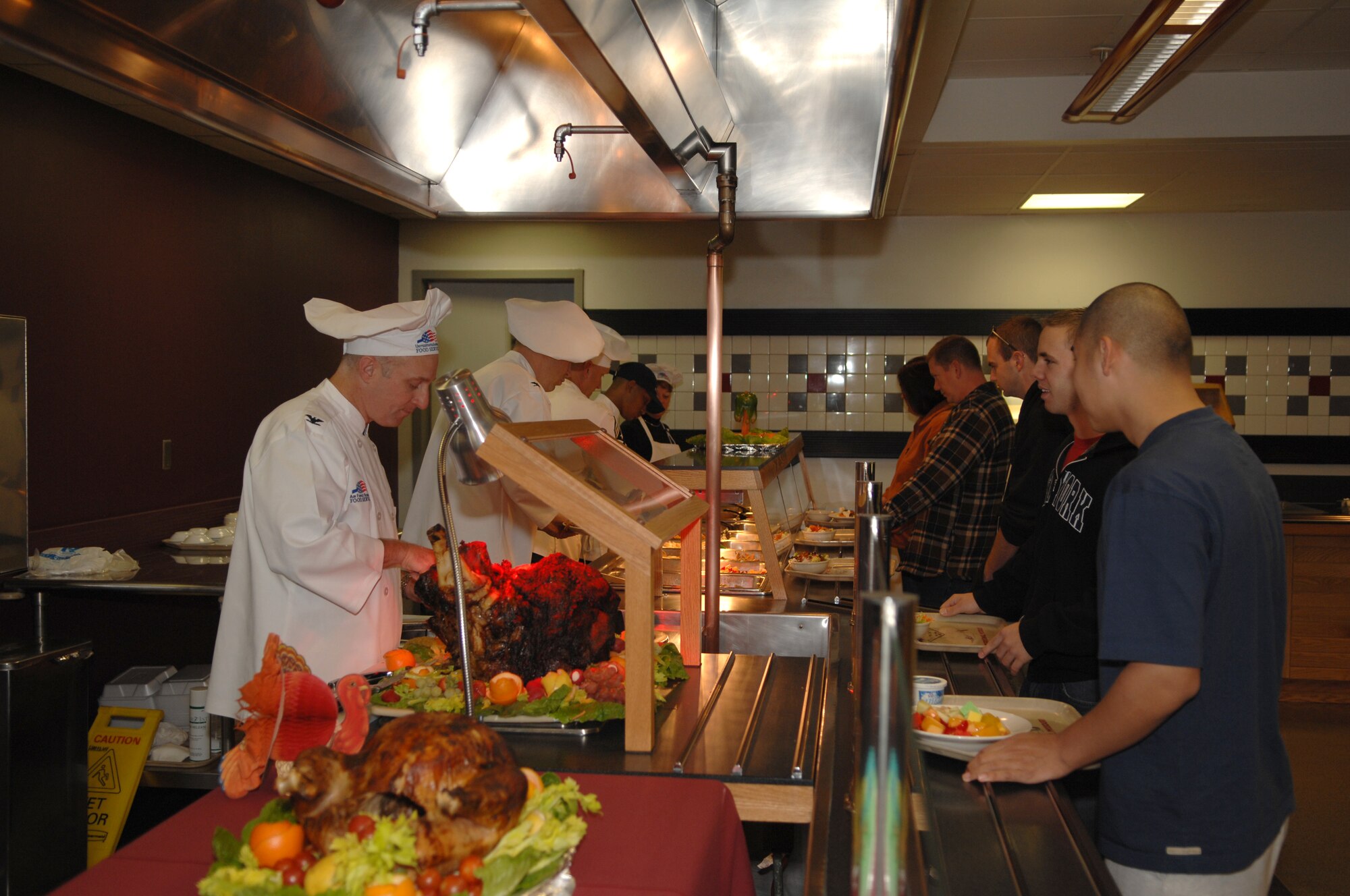 WHITEMAN AIR FORCE BASE, Mo. – Col. Garrett Harencak, 509th Bomb Wing commander, Col. John Robinson, 509th BW vice commander and Chief Master Sgt. Brian Hornback, 509th BW command chief master sergeant, serve Thanksgiving Dinner to members of Team Whiteman at the Ozark Inn Dining Facility Nov. 22. The dinning facility provided 150 active duty, dependants and retired Air Force individuals with turkey, roast beef, ham and the traditional side dishes such as stuffing, corn, mashed potatoes.  (U.S. Air Force photo/ Airman 1st Class Jessica M. Snow)
