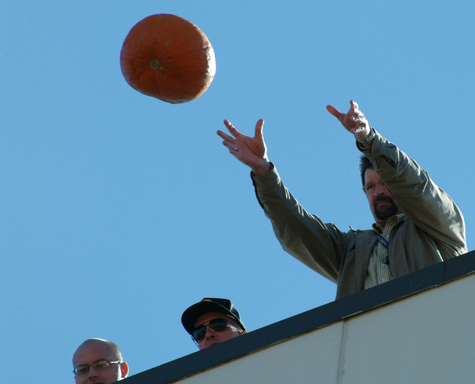 Anthony Ordner, 28th Test and Evaluation Squadron, releases his pumpkin Nov. 16 during the 28th TES's annual pumpkin drop.  Sixteen contestants participated as a squadron representative or in the individual competition.  More than $120 was raised for the 53d Wing's children's Christmas party.  The Electronic Warfare Division won the squadron competition while John Terry won the individual.  U.S. Air Force photo by Staff Sgt. Samuel King Jr.