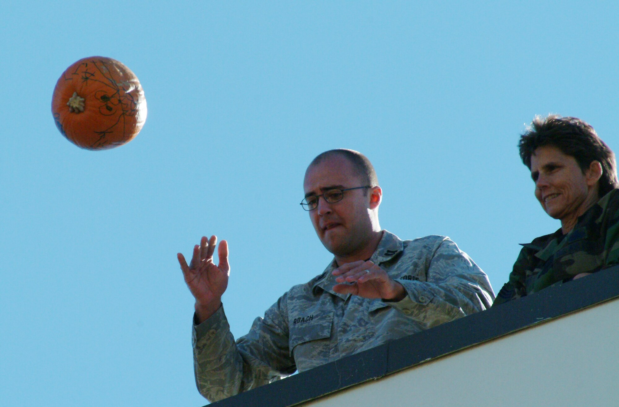 Capt. Ryan Roach, 28th Test and Evaluation Squadron, releases his pumpkin Nov. 16 during the 28th TES's annual pumpkin drop.  Sixteen contestants participated as a squadron representative or in the individual competition.  More than $120 was raised for the 53d Wing's children's Christmas party.  The Electronic Warfare Division won the squadron competition while John Terry won the individual.  U.S. Air Force photo by Staff Sgt. Samuel King Jr.