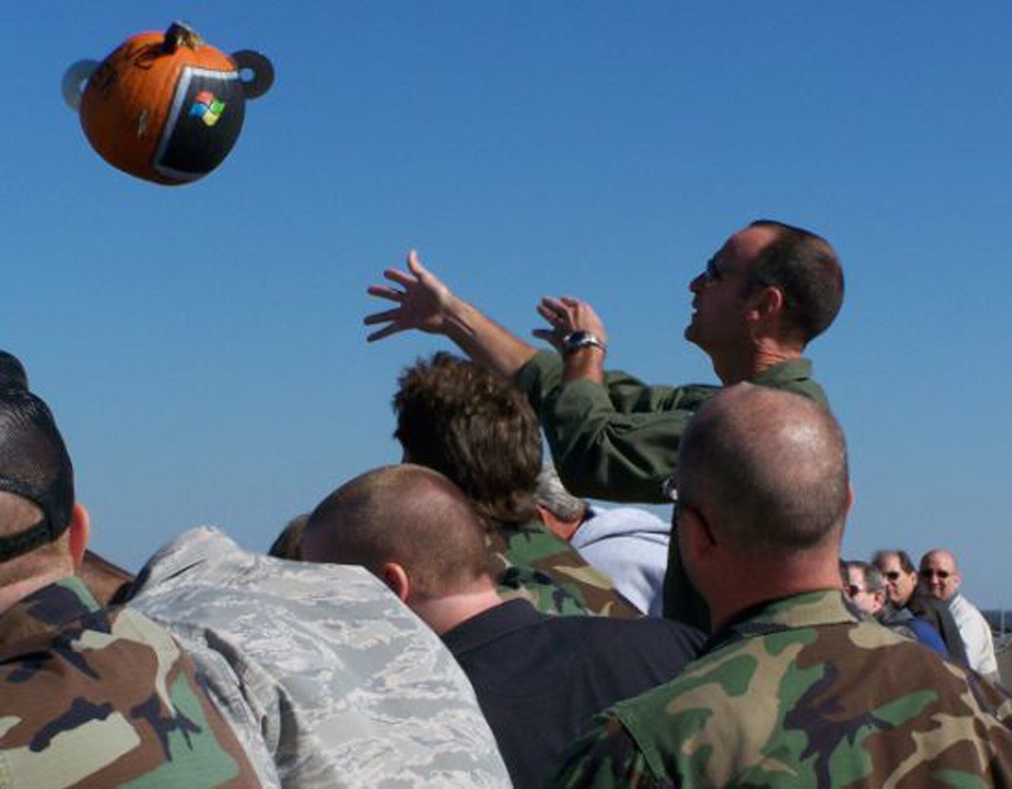 Lt. Col. Henri Castelain, 28th Test and Evaluation Squadron commander, releases his "Windows" powered pumpkin Nov. 16 during the 28th TES's annual pumpkin drop.  Sixteen contestants participated as a squadron representative or in the individual competition.  More than $120 was raised for the 53d Wing's children's Christmas party.  The Electronic Warfare Division won the squadron competition while John Terry won the individual.  U.S. Air Force photo.