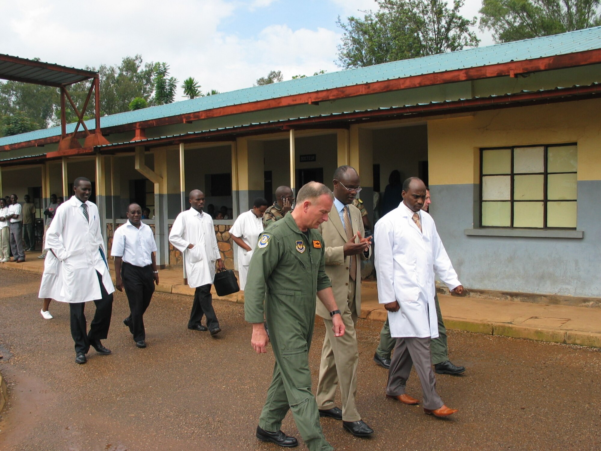 U.S. Air Force Maj. Gen. Jack B. Egginton, 3rd Air Force vice commander, and Rwandan Eugene Zimlunda from the U.S. Department of Defense Presidential Emergency Plan for AIDS Relief, discuss the combined efforts of U.S. and Rwandans in the fight against AIDS during General Egginton's visit to a U.S.-sponsored AIDS clinic in Rwanda Nov. 16. (U.S. Air Force photo by Master Sgt. Bert Gillott)