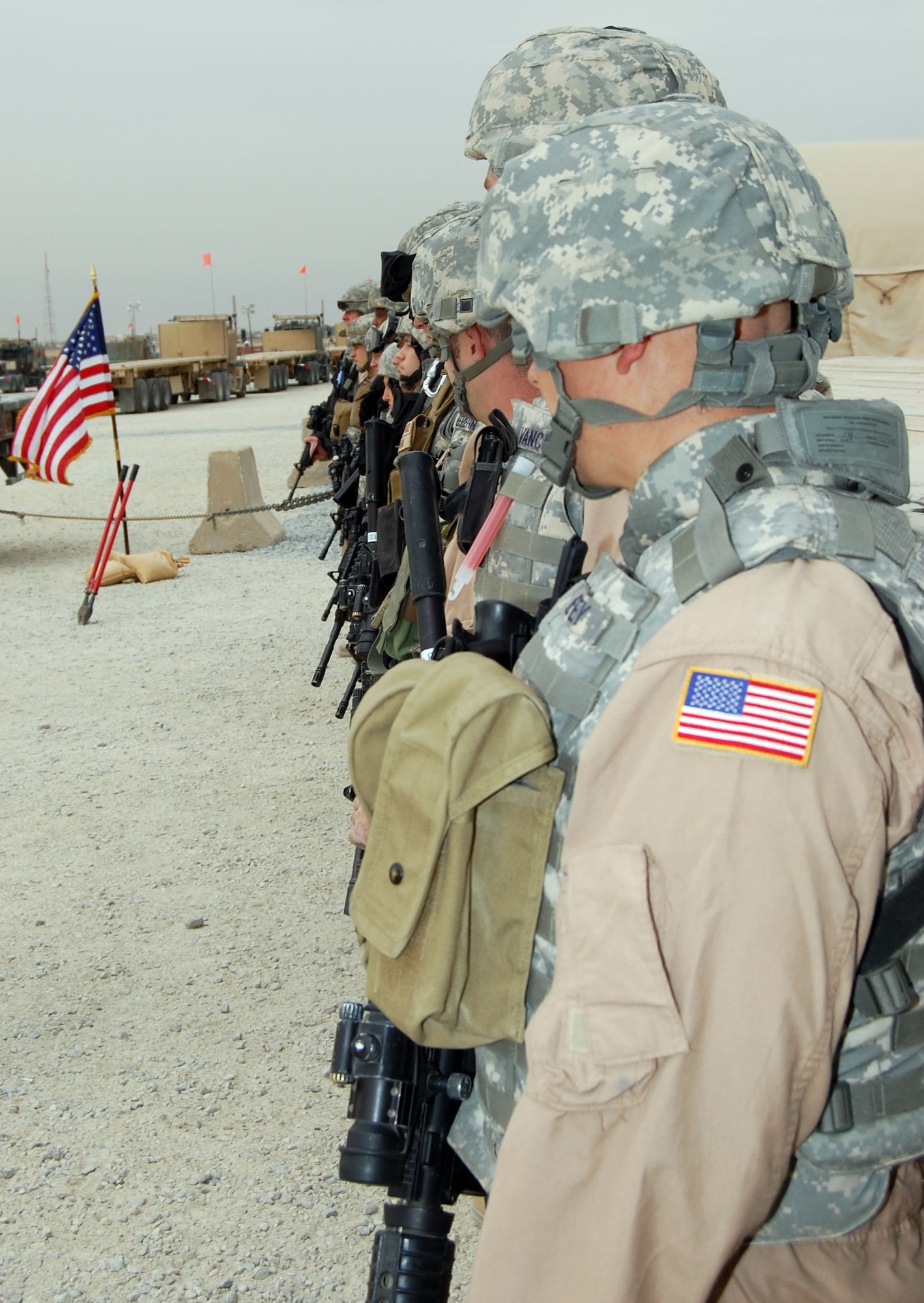 SOUTHWEST ASIA – Airmen of the 586th Expeditionary Logistics Readiness Squadron stand in formation awaiting a ceremony Nov. 24 at Camp Arifjan, Kuwait. The ceremony marked the grand opening of the new convoy support center. The center was created to consolidate all convoy support functions.  (Air Force photo\Staff Sgt. Phillip Butterfield)