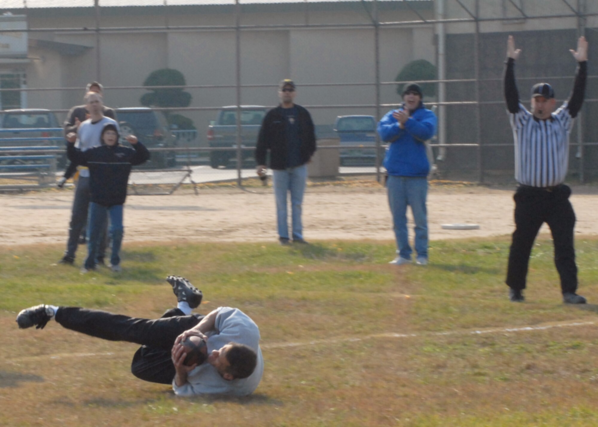 KUNSAN AIR BASE, South Korea—  Colonel Timothy Sakulich, 8th Mission Support Group commander, catches the football and scores the only touchdown for his team  here Nov. 23. The chiefs won the game 26 to 6 against the Eagles. The game is one of several sporting competitions between the two groups that have taken place during the course of the year.  (U.S. Air Force Photo/Staff Sgt. Araceli Alarcon) 
