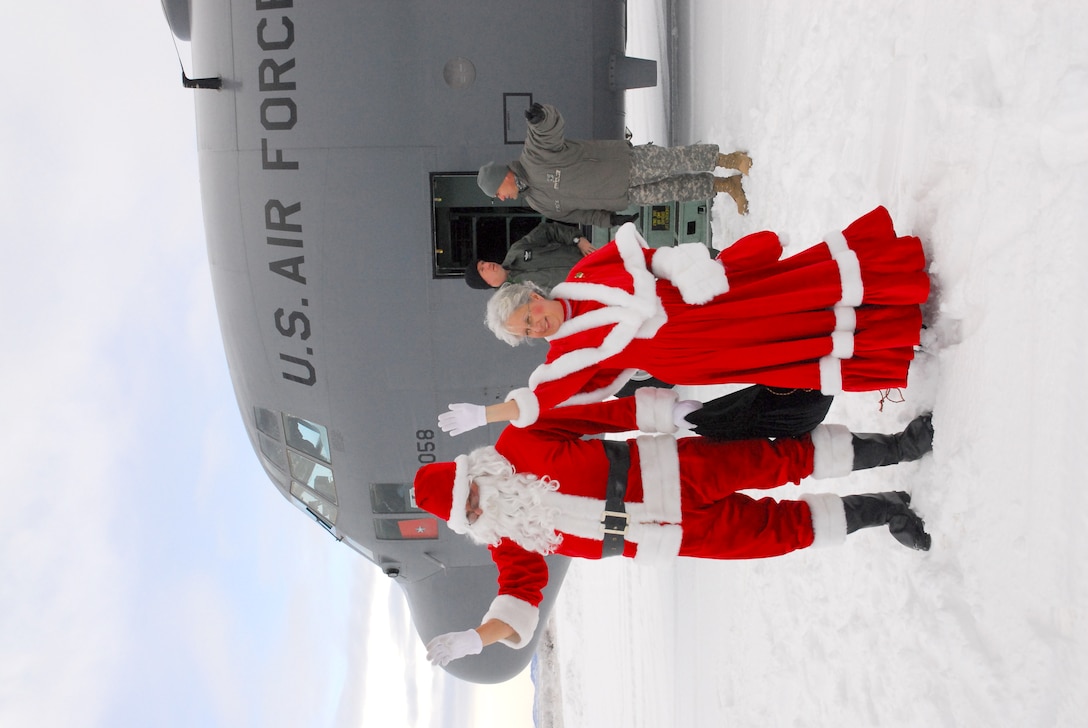 Santa And Mrs. Claus Disembark From An Air National Guard C-130 ...