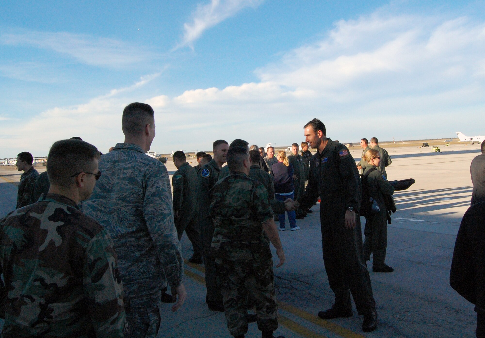 LAUGHLIN AIR FORCE BASE, Texas – Laughlin well wishers congratulate Col. Mike Minahan, 47th Flying Training Wing commander, after his final flight here Nov. 26. Colonel Minahan was recently selected as Executive Officer to U.S. European Command Deputy Commander Vice Admiral Richard Gallagher at USEUCOM Headquarters in Stuttgart, Germany. Col. Minahan will soon depart Laughlin for Germany after almost two years of command. (U.S. Air Force photo by Senior Airman Olufemi Owolabi)
