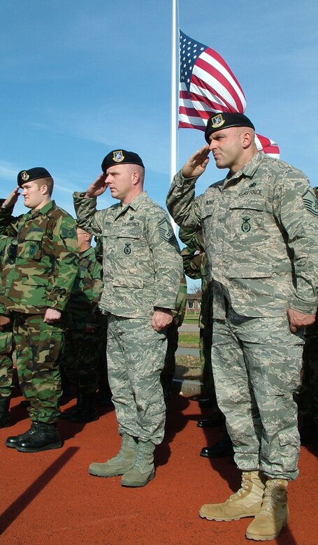 Members of the 439th Security Forces Squadron salute during Westover's annual Veteran's Day retreat ceremony, held at the Base Ellipse in November. (US Air Force photo/Master Sgt. W.C. Pope)