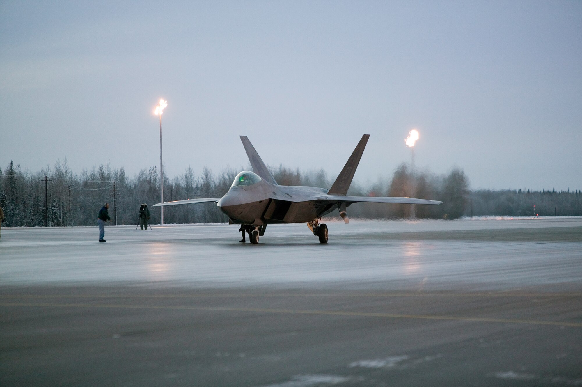 EIELSON AIR FORCE BASE, Alaska-- An F-22 Raptor crew, from Edwards AFB, Calif., performs manuevering, stoping and going on low runway conditions Nov. 7 on the south ramp of the flightline. The Raptor underwent cold-weather testing on its breaking system, with imphasis on its ability to maneuver, stop and go on slippery surfaces. The aircraft was tested by the 411th Flight Test Squadron during a three-week deployment on incrementally low-level runway condition reading surfaces, with temperatures ranging between 37 to -13 degrees, with an objective to have the report finished by Elmendorf's first winter. (U.S. Air Force photo by Kevin Roberston)