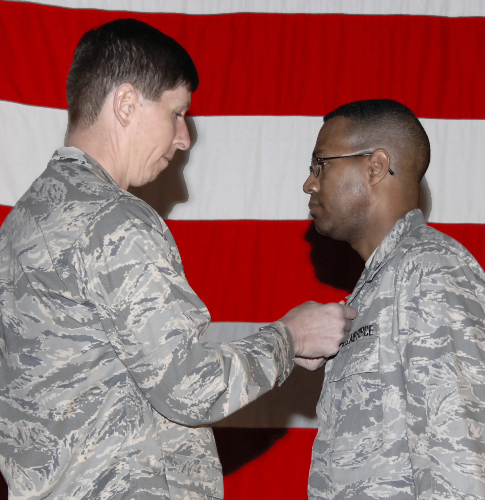 Col. Richard Klumpp Jr., 71st Flying Training Wing commander, pins a Bronze Star Medal to the uniform of Lt. Col. Daryl Cunningham, 71st Mission Support Group deputy commander. Colonel Cunningham received the Medal for his service and achievements during his command of the 586th Expeditionary Logistics Readiness Squadron in Kuwait from April 2 to Sept. 27. (U.S. Air Force photo by Terry Wasson)
