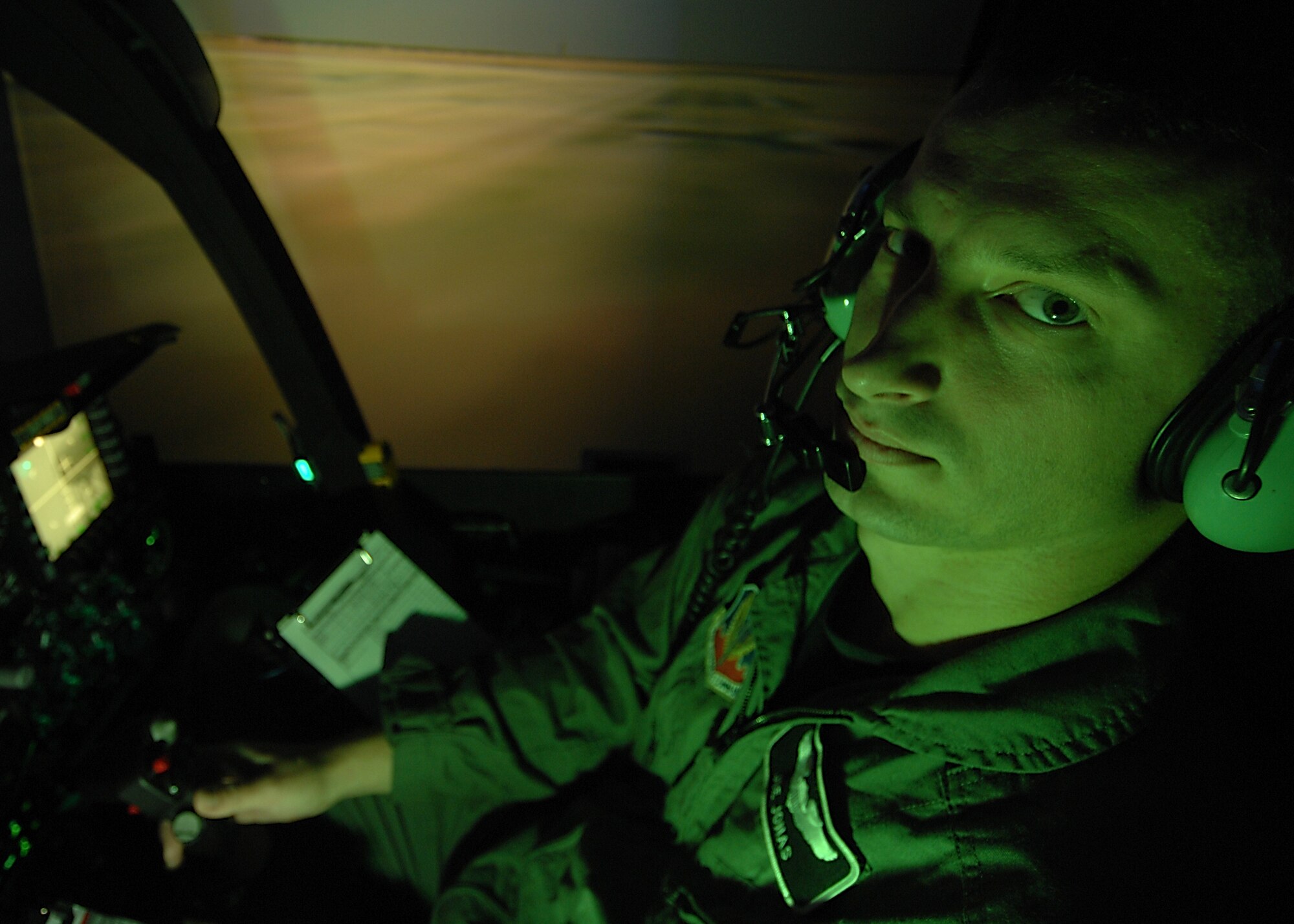 MOODY AIR FORCE BASE, Ga. -- 1st Lt. Jozsef Jonas, 75th Fighter Squadron, operates an A-10C Thunderbolt II full mission trainer during an emergency procedure training session Nov. 27. Pilots use this simulator to practice handling dangerous aircraft malfunctions. (U.S. Air Force photo by Airman First Class Brittany Barker)