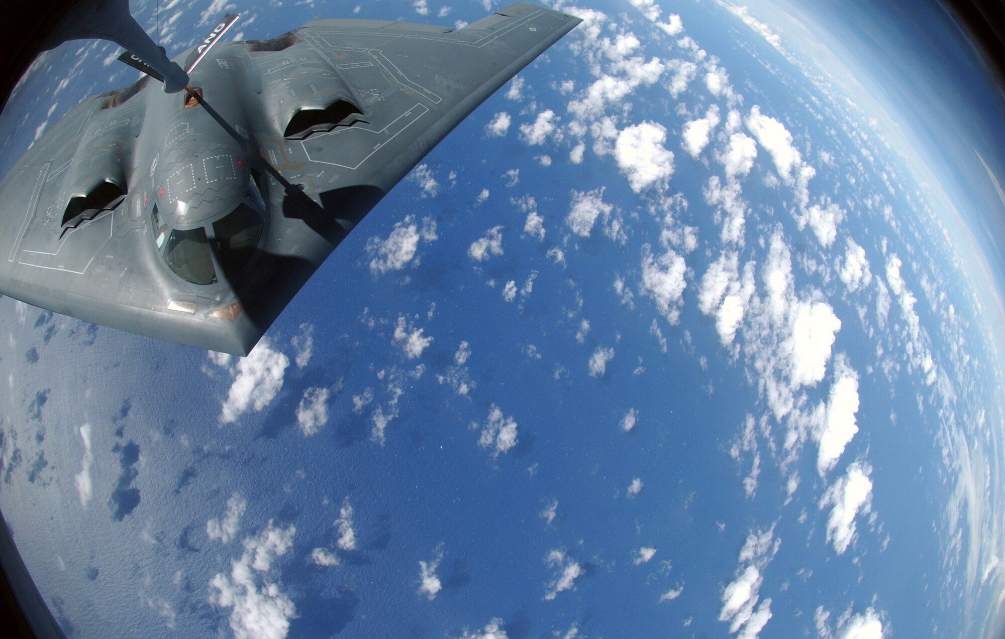 A KC-135 Stratotanker refuels a B-2 Spirit Nov. 20 over the Pacific Ocean. The B-2 and KC-135 are deployed to Andersen Air Force Base, Guam, to support U.S. Pacific Command's continuous bomber presence and theater security package operations. The KC-135 is assigned to the from the 121st Refueling Squadron from Rickenbacker International Airport at Columbus, Ohio. The B-2 is assigned to the 509th Bomb Wing from Whiteman AFB, Mo. (U.S. Air Force photo/Senior Airman Brian Kimball) 
 