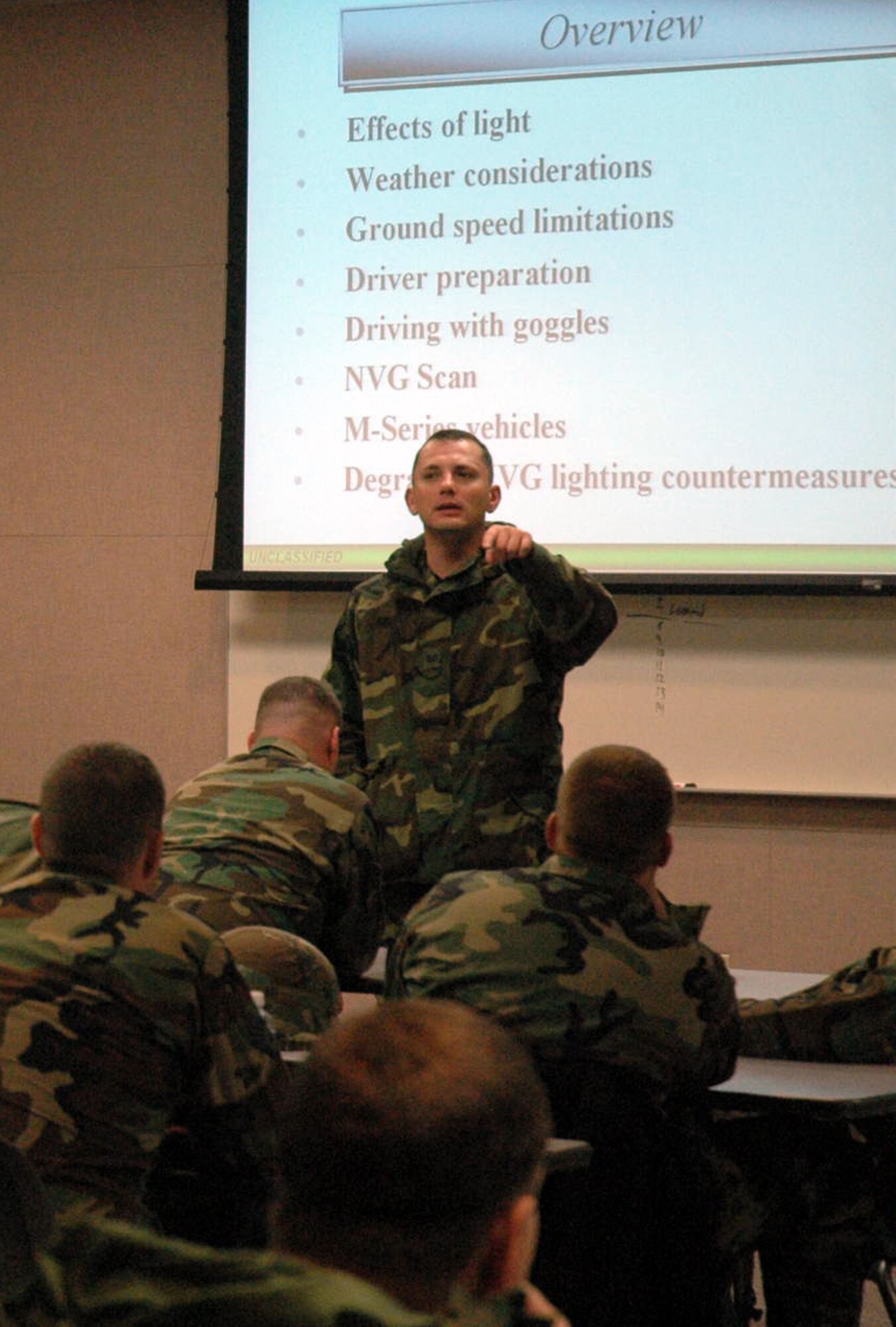 Tech. Sgt. James Caywood, an instructor for the Air Force Contingency Response Formal Training Unit Basic Course 08-1 and the Air Force CR FTU Advanced Course 08-1, passes on some administrative notes to students prior to the start of a class on night vision goggles and night vision training Nov. 15 at Fort Dix, N.J.  Sergeant Caywood, from the U.S. Air Force Expeditionary Center's Mobility Operations School, is one of several instructors for the 22-day courses. (U.S. Air Force Photo/Tech. Sgt. Scott T. Sturkol)