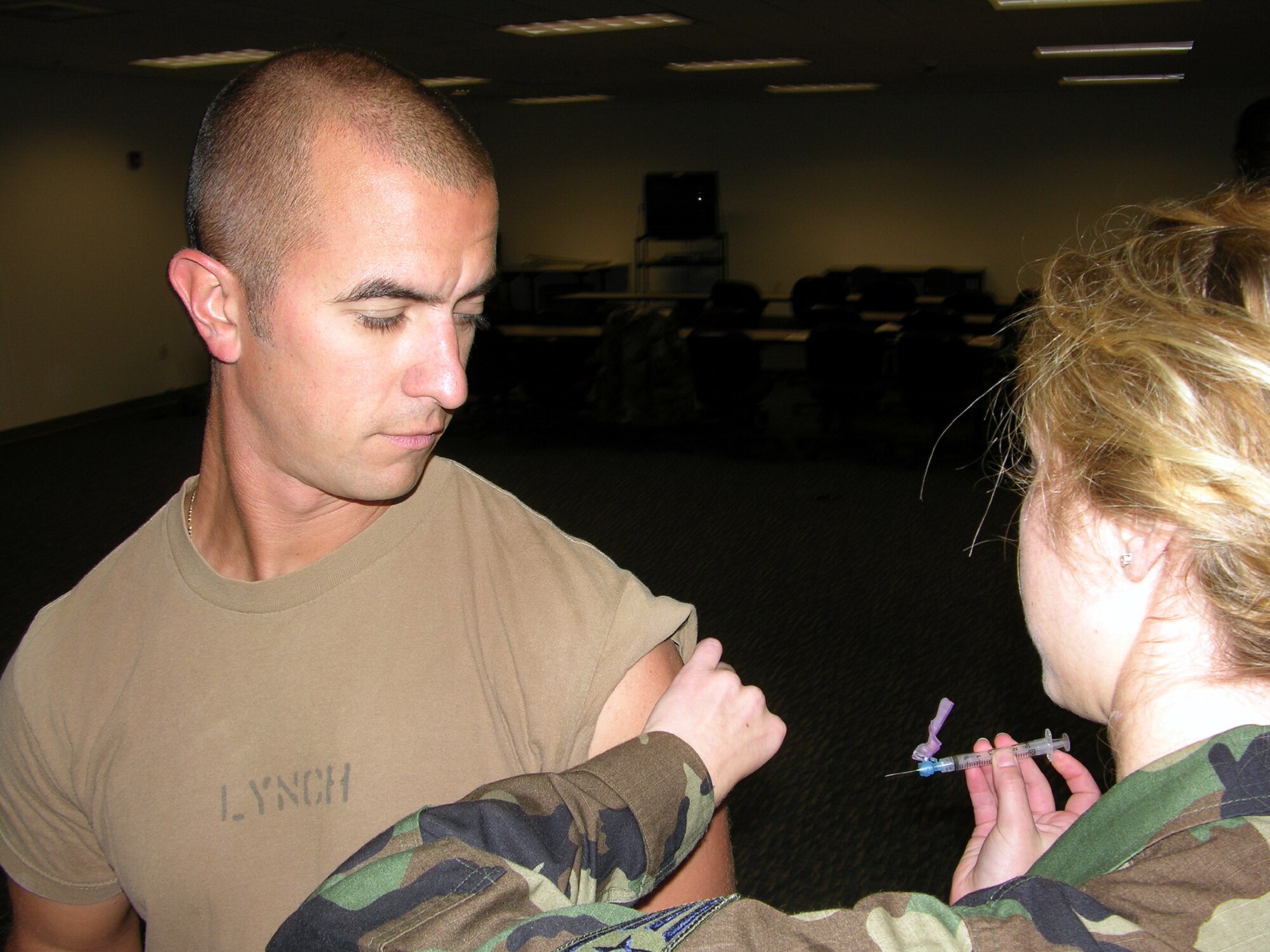 SEYMOUR JOHNSON AIR FORCE BASE, N.C.--Capt. Matthew Lynch, the officer in charge of the 916th Military Personnel Flight here, receives his annual flu vaccination. The shots were administered at the 916th Security Forces Squadron during the November unit training assembly and will continue for the next several months. Peak season for the flu is December through March and nearly 50 million cases of the flu are reported each year in the United States alone.