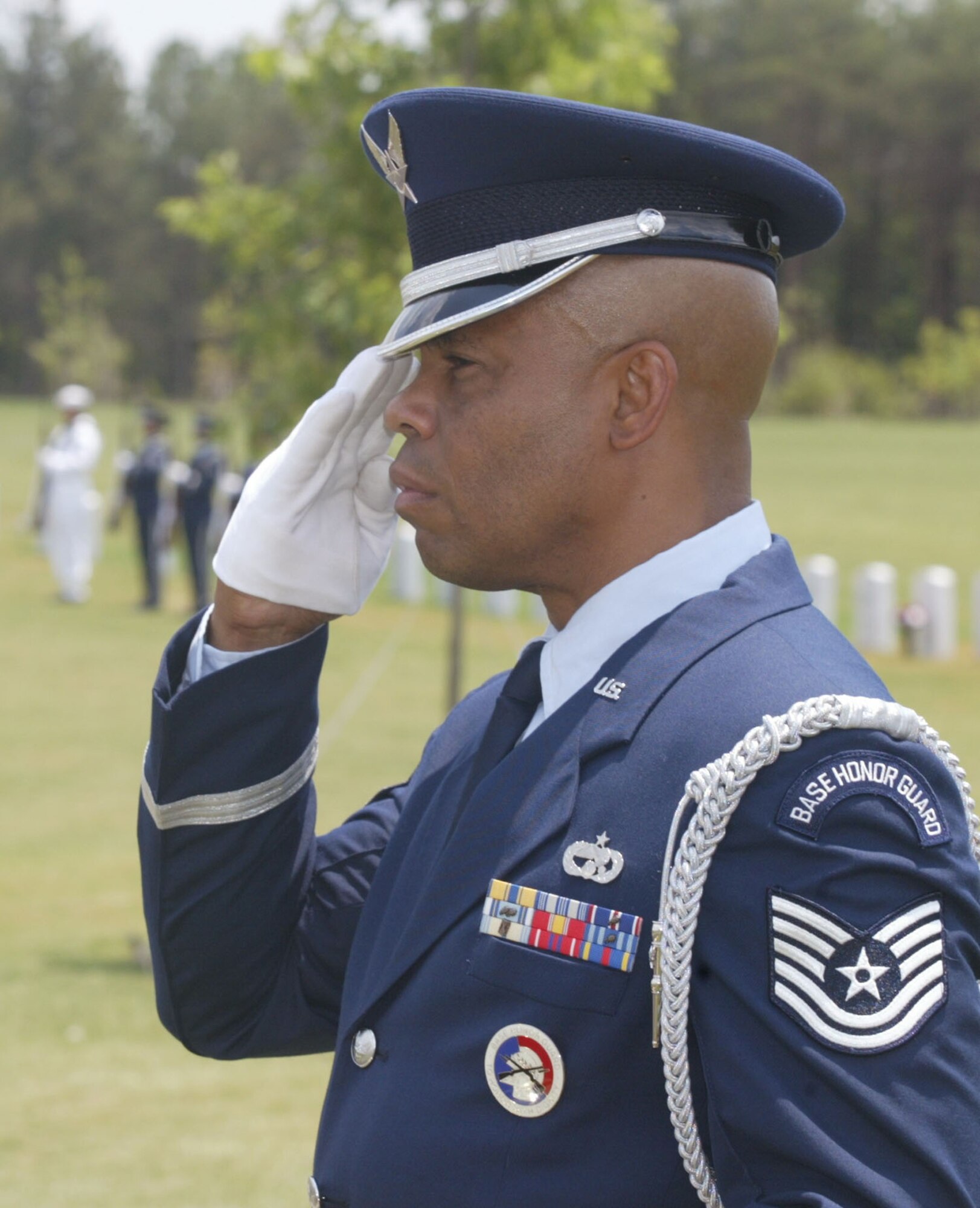 Tech. Sgt. Danny P. Wilson, 80th APS air cargo specialist, and member of the Dobbins Air Reserve Base Honor Guard, salutes during a ceremony at a local veteran's cemetary. 