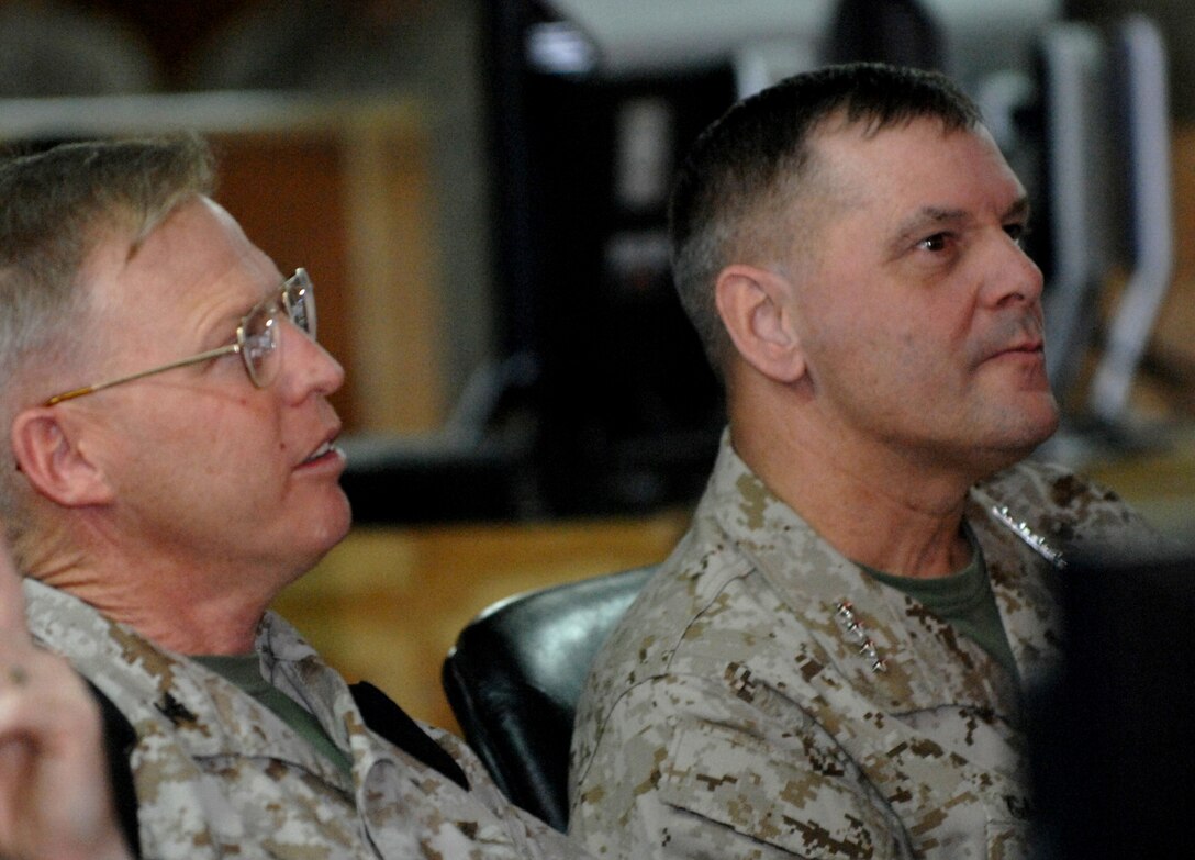 Vice Chairman of the Joint Chiefs of Staff Marine Corps Gen. James E. Cartwright, right, receives a mission brief from Marine Corps Col. Thomas Gaskill, chief of staff for the 2nd Marine Aircraft Wing (Forward), at Al Asad Air Base, Iraq, Nov. 22, 2007. Cartwright visited four locations Thanksgiving day to see troops and receive mission updates. 