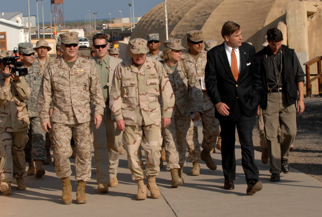 Vice Chairman of the Joint Chiefs of Staff Marine Corps Gen. James E. Cartwright, foreground left, walks with Combined Joint Task Force-Horn of Africa commander Navy Rear Adm. Jim Hart, foreground center, and U.S. Ambassador to Djibouti W. Stuart Symington, during a visit to Camp Lemonier, Djibouti, Nov. 23, 2007. Cartwright brought a USO show for the troops and received mission updates on operations in the country. 