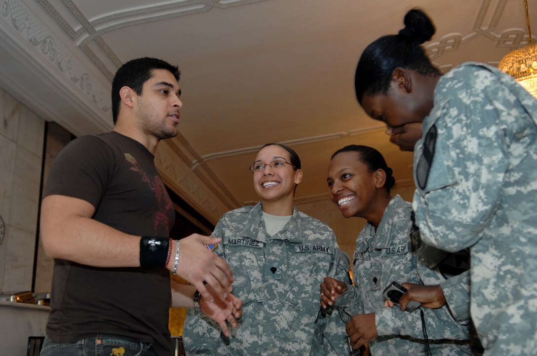 Actor Wilmer Valderrama jokes around with, from left to right, Army Spc. Orianna Martinez, Spc. Latisha Martinez and Sgt. Lashandra Langford following a breakfast at Camp Liberty, Iraq, Nov. 23, 2007. Valderrama traveled with Vice Chairman of the Joint Chiefs of Staff Marine Corps Gen. James E. Cartwright to visit troops for Thanksgiving. 