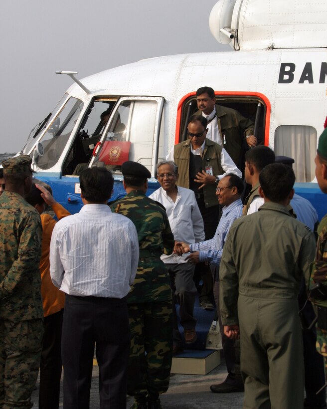 Ahmed Fakhuddin, chief advisor of the Government of Bangladesh steps off a helicopter during a visit to Barisal Airfield, Bangladesh, Nov. 27, 2007. Barisal was one of the stops Fakhuddin made on his tour of areas affected by Tropical Cyclone Sidr. (Official Marine Corps photo by Sgt. Ezekiel R. Kitandwe) (Released)