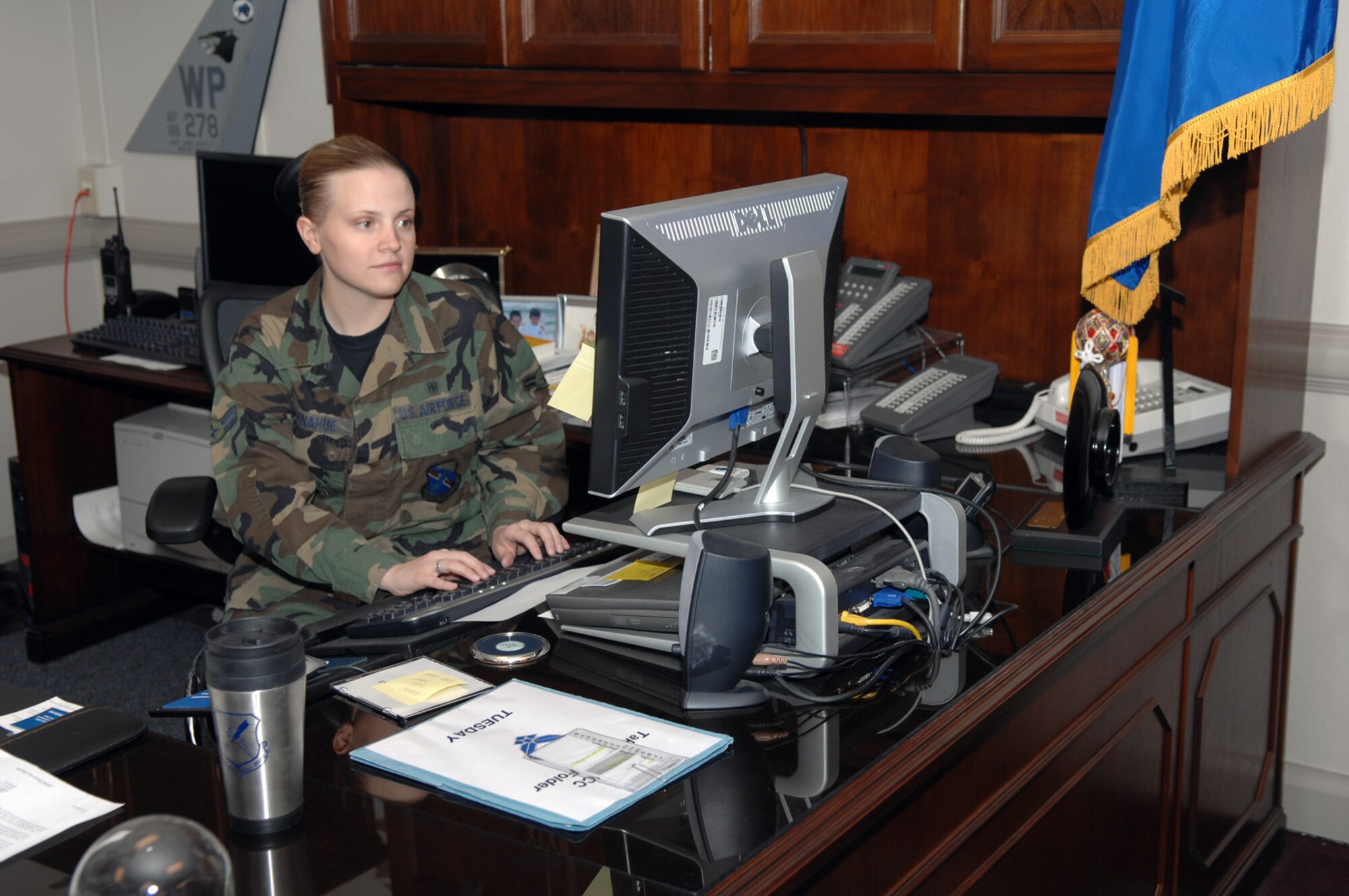 Airman 1st Class Catherine Donahue, 99th Medical Operations Squadron family practice clinic medical technician, performs duties while shadowing Col. Michael Bartley, 99th Air Base Wing commander, as part of the Shadow a Commander for a Day program.
(U.S. Air Force photo by Airman 1st Class Brian Ybarbo) 