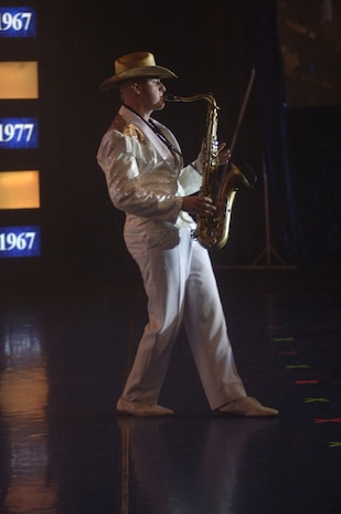 Senior Airman Jeremiah Smith, Air Force Tops in Blue performer, steps up and plays a solo performance Nov. 24 at the North Charleston Performing Arts Center. (U.S. Air Force photo/Staff Sgt. April Quintanilla)