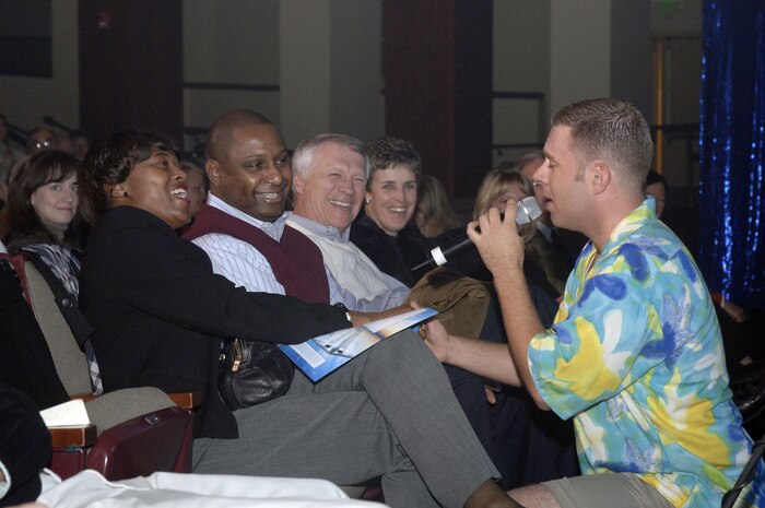 Senior Airman Nicholas Amari, Air Force Tops in Blue performer, serenades Chief Master Sgt. Bernise Belcer, 437th Airlift Wing command chief, during the Air Force Tops in Blue performance Nov. 24 at the North Charleston Performing Arts Center. (U.S. Air Force photo/Staff Sgt. April Quintanilla)