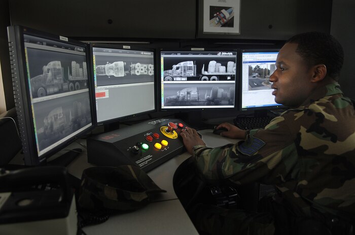 Tech. Sgt. Dante Roberts, 437th Security Forces Squadron, views the X-ray of a semi-truck carrying a load of tires as it passes through the new X-ray security system at the Rivers Gate on Charleston AFB. Charleston AFB is the first base in the Department of Defense to have the security X-ray system. (U.S. Air Force photo/Senior Airman Nicholas Pilch)