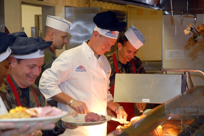 Col. John "Red" Millander, 437th Airlift Wing commander, and members of Team Charleston's base leadership serve Thanksgiving dinner to Airmen and their families Nov. 22 at the Gaylor Dining Facility. (U.S. Air Force photo/Tech. Sgt. Paul Kilgallon)