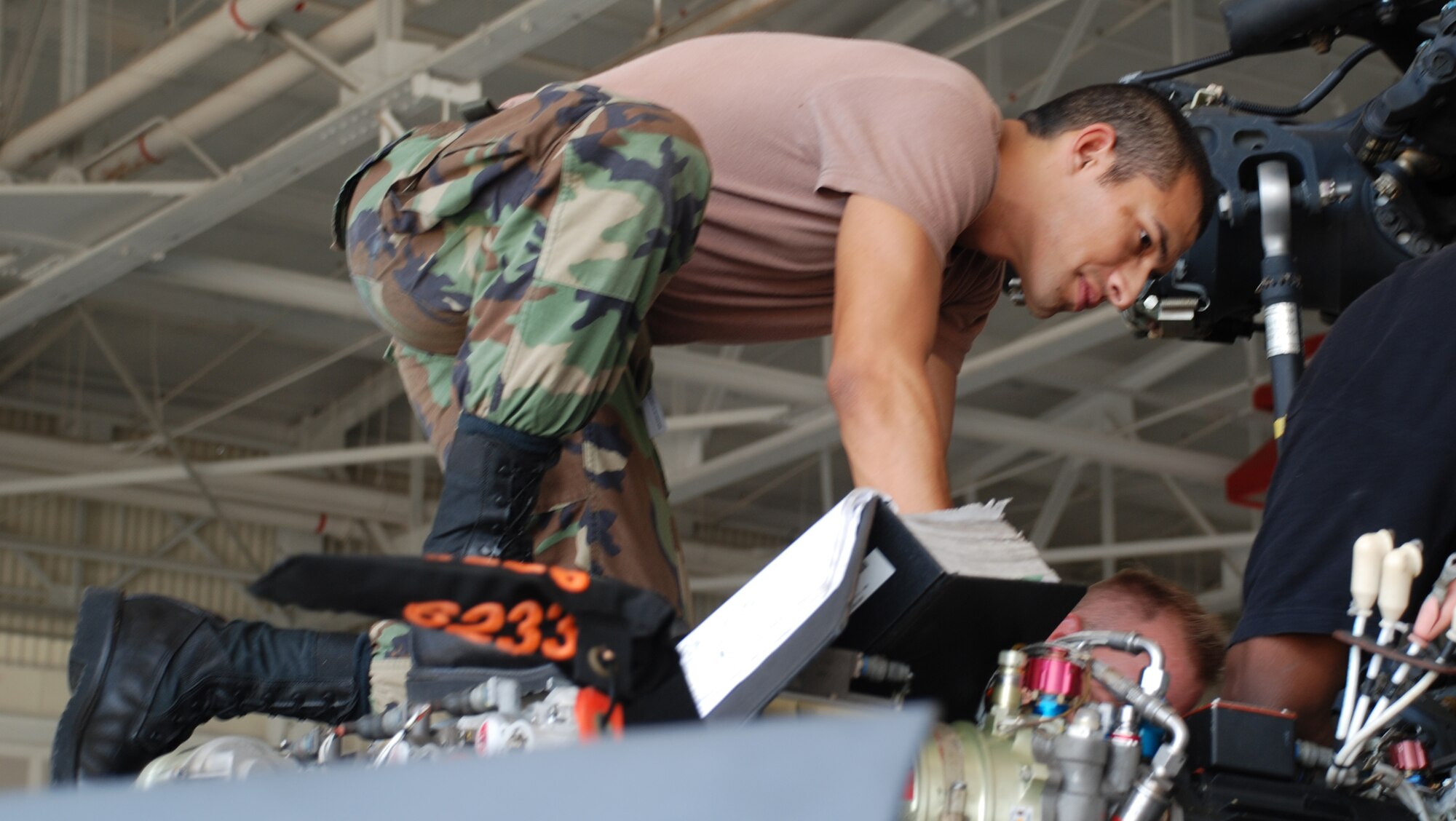 Combat rescue maintainer, Senior Airman Dimas Garcia, 920th Rescue Wing, assists in the reinstallation on the main gear box on an HH-60G Pave Hawk helicopter.  The primary mission of the Pave Hawk helicopter is to conduct day or night combat search and rescue, or CSAR, operations into hostile environments to recover downed aircrew or other isolated personnel during war. Because of its versatility, the HH-60G is also tasked to perform military operations other than war. These tasks include civil search and rescue, emergency aeromedical evacuation, disaster relief, international aid, counterdrug activities and NASA space shuttle support. 