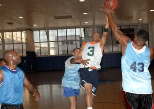 LANGLEY AIR FORCE BASE, Va. -- Troy Baker, guard for the 1st Logistics Readiness Squadron, takes the basketball to the rim during the game against the 1st Security Forces Squadron at the Air Combat Command Fitness Center Nov. 28. Baker and the 1st LRS held the 1st SFS at 14 points in the first half, and although Roger Hobbs led the 1st SFS into the second half with 14 points, 1st LRS defeated 1st SFS with dominating defense, 54-39. (U.S. Air Force photo/Airman 1st Class Aaron Johnson)