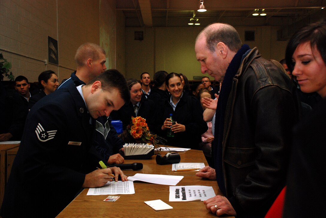 Staff Sgt. Brian Schaaf, NCO in charge of the Solid Rock Cafe, helps Rex Keese, a local resident of Wichita Falls, to sign up for Operation Thanksgiving Nov. 22 at the Solid Rock Cafe. (U.S. Air Force photo/Airman 1st Class Jacob Corbin)