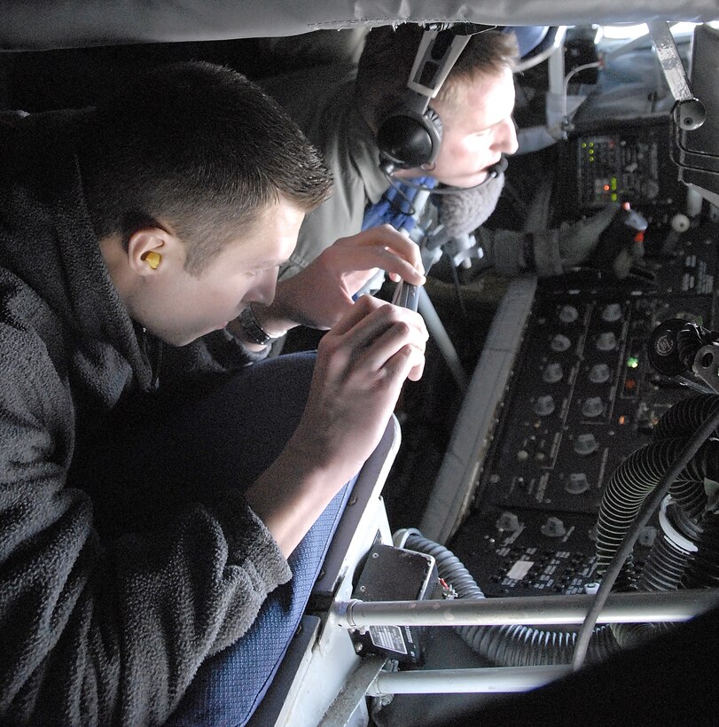 An employer of a 442nd Fighter Wing reservist joins Tech. Sgt. Justin Hopkins, a boom operator with the 465th Air Refueling Squadron at Tinker AFB, Okla., to monitor the in-flight refueling of one of the 442nd's A-10 Thunderbolt IIs while flying aboard a KC-135 Stratotanker. Two tankers and crews from the 465th ARS provided a flight for 442nd FW employers during the wing's annual Employer Appreciation Day, Nov. 3. The 442nd FW is an Air Force Reserve Command fighter unit based at Whiteman AFB, Mo. (US Air Force photo/Master Sgt. Bill Huntington)