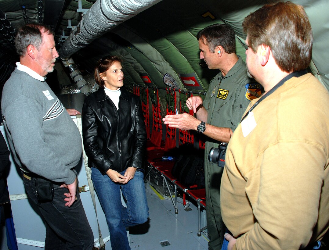 During the 442nd Fighter Wing's annual Employer Appreciation Day here Nov. 3, Lt. Col. John Rogler, 303rd Fighter Squadron (center) discusses flying with a group of employers while aboard a KC-135 Stratotnker during the refueling flight portion of the day's events. (US Air Force photo/Staff Sgt. Tom Talbert)