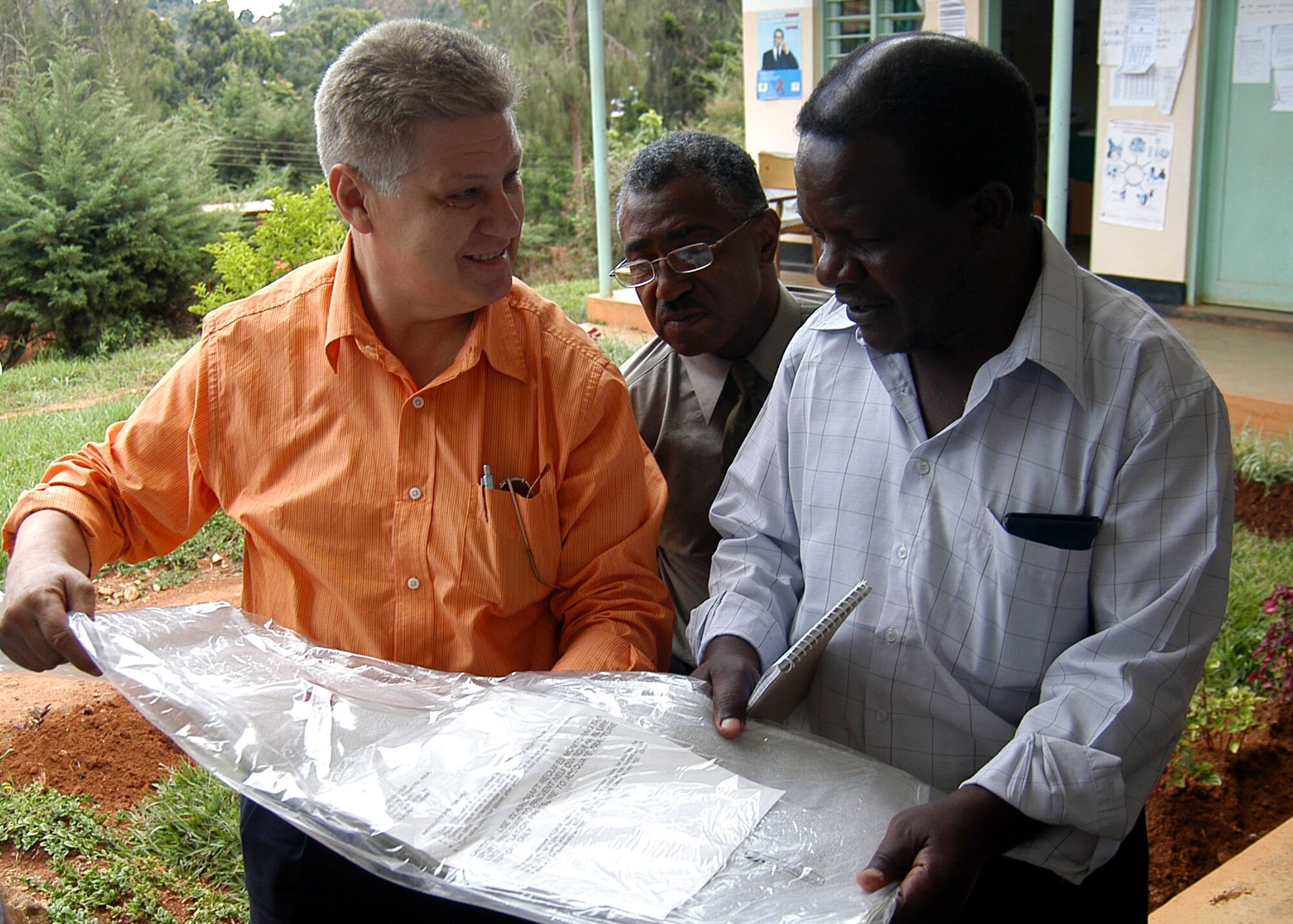 Army Staff Sgt. Felix B. Crespo (left) shows a splint to Dr. Yateri Salimir (right) as Air Force Chaplain (Lt. Col.) Lawrence F. Keith listens to how the splint is used. Six medical kits were delivered to the Lushoto District Hospital by the civil affairs team Nov. 21. Sergeant Crespo, a Miami native, is the team sergeant for Civil Affairs Team 11 of C Company, 486th Civil Affairs Battalion. Chaplin Keith, a Blytheville, Ark., native, is the Combined Joint Task Force-Horn of Africa Religious Affairs deputy director. Salimir is a doctor for the hospital, which assists 13 clinics in the district. (U.S. Air Force photo/Staff Sgt. Jennifer Redente)