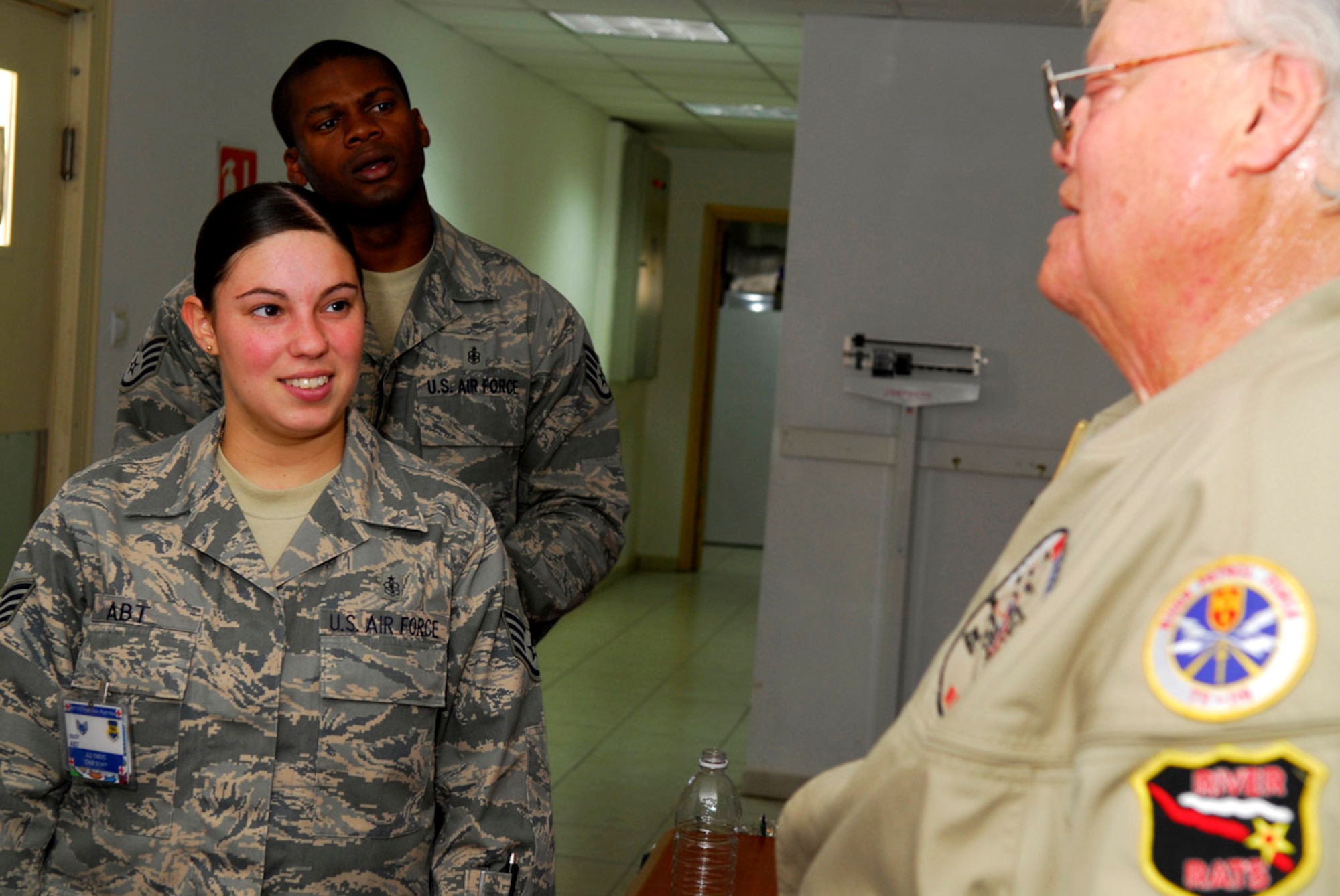 Staff Sgt. Christina Abt and Staff Sgt. Terrell Kelley of 332nd Contingency Aeromedical Staging Facility met with Dave Roever Nov. 26 at Balad Air Base, Iraq. A severely disabled Vietnam War veteran, Mr. Roever visited Soldiers and Airmen around the base sharing a message of hope. Sergeant Abt is deployed from Langley Air Force Base, Va., and Sergeant Kelley is deployed from Charleston AFB, S.C. (U.S. Air Force photo/Staff Sgt. Joshua Garcia) 
