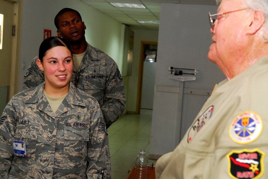 Staff Sgt. Christina Abt and Staff Sgt. Terrell Kelley of 332nd Contingency Aeromedical Staging Facility met with Dave Roever Nov. 26 at Balad Air Base, Iraq. A severely disabled Vietnam War veteran, Mr. Roever visited Soldiers and Airmen around the base sharing a message of hope. Sergeant Abt is deployed from Langley Air Force Base, Va., and Sergeant Kelley is deployed from Charleston AFB, S.C. (U.S. Air Force photo/Staff Sgt. Joshua Garcia) 
