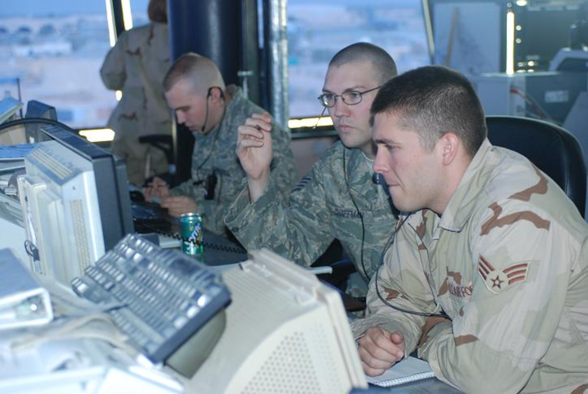 BALAD AIR BASE, Iraq -- Senior Airman Josiah Clark, right, and Staff Sgt. Nathan Chaffman,  332nd Expeditionary Operations Support Squadron air traffic controllers, monitor the radar screen in the  air traffic control tower here. They monitor more than 300 aircraft on a daily basis. Airman Clark is deployed from Dover Air Force Base, Del., and Sergeant Chaffman is deployed from Mountain Home AFB, Idaho. (U.S. Army photo/Spc. Jay Venturini)
