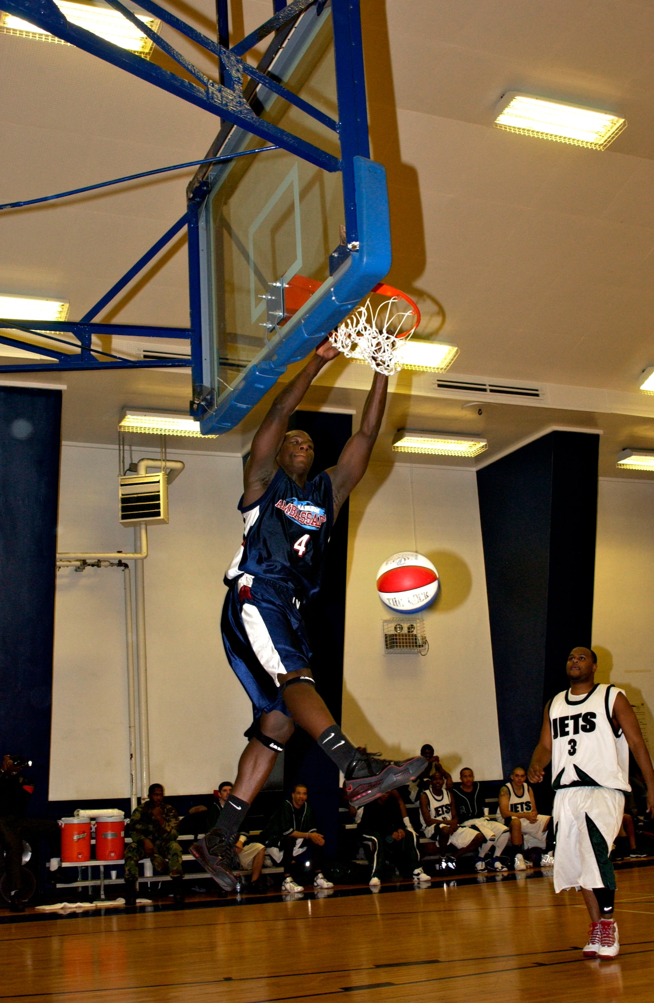 MISAWA AIR BASE, Japan -- Angel Branch from the Harlem Ambassadors dunks a basketball during a game between the Ambassadors and the Misawa Jets here on Nov. 28, 2007. The Ambassadors put on a two-hour show for the Misawa audience that included expert dribbling and basketball moves, comedy, dancing and games with the local children. The team also signed autographs following the game. (US Air Force photo by Airman 1st Class Eric Harris)