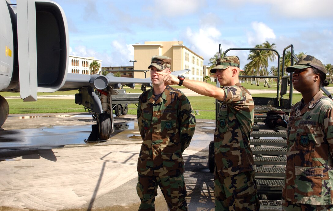 Andersen’s Airman are already taking time from their day to admire the F-4E’s new appearance. This aircraft now reflects the current wing organization. F-4s were never formally assigned to Andersen; however, the base was a major hub for combat fighter flights to and from Southeast Asia in the 1960s – 1970s. These Airmen, Staff Sgt. Matasha Stinson (right), Lt. Jeremy Hirsch and Senior Airman Tyler Cresap, all from the 393rd Expeditionary Bomb Squadron, stopped by the display and reflected on this tangible piece of the Air Force’s heritage and legacy. (Air Force photo/Tech. Sgt. Steven Wilson)
