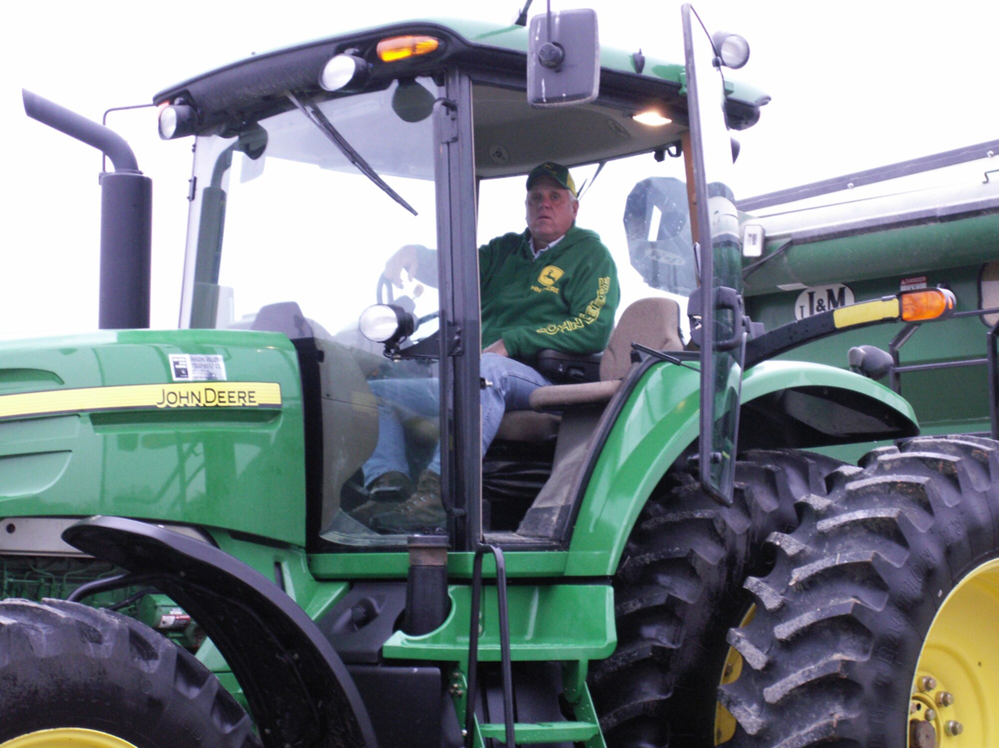 Farmer and recently retired Tech Sgt. Gary Heuring sits atop his favorite "green" tractor near Smithton as he prepares to plow a field.  Sergeant Heuring finished his career in the 932nd Airlift Wing Maintenance Group after 29 years.  