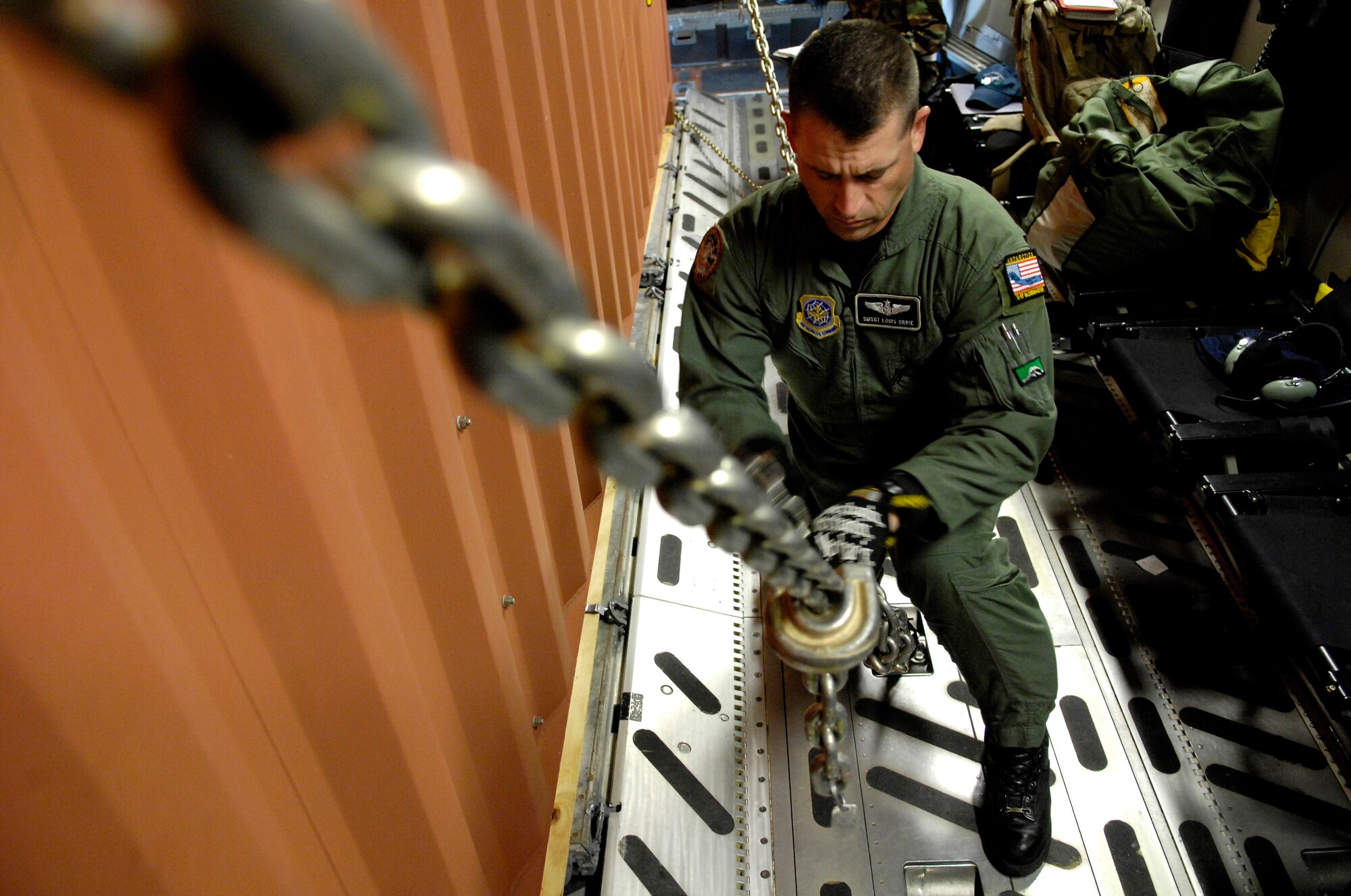 Senior Master Sgt. Louis Orrie tightens a cargo chain on a C-17 Globemaster III prior to taking off from Christchurch, New Zealand Nov. 26, 2007 during Operation Deep Freeze. Sgt. Orrie, a loadmaster, along with other Reserve and active duty Airmen from McChord Air Force Base, Wash. are at Christchurch supporting the 13th Air Force-led Joint Task Force Support Forces Antarctica, Operation Deep Freeze. Operation Deep Freeze is a unique joint and total force mission that has supported the National Science Foundation and U.S. Antarctic Program that began in 1955. (U.S. Air Force photo/Tech. Sgt. Shane A. Cuomo)




