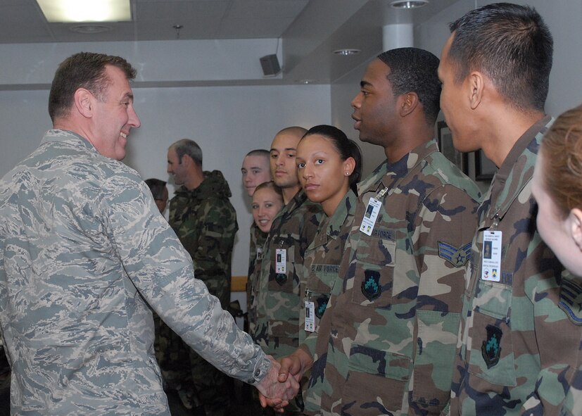 KUNSAN AIR BASE, South Korea--Major General Gar Graham, Assistant Surgeon General for Dental Services, shakes hands with Airmen from the 8th Medical Operational Squadron Nov. 29 here.  During the general's one day visit he thanked medical technicians for ensuring the health and wellness of Airmen along with their service to the nation and answered their questions during an all-hands call. (U.S. Air Force photo/Senior Airman Giang Nguyen)