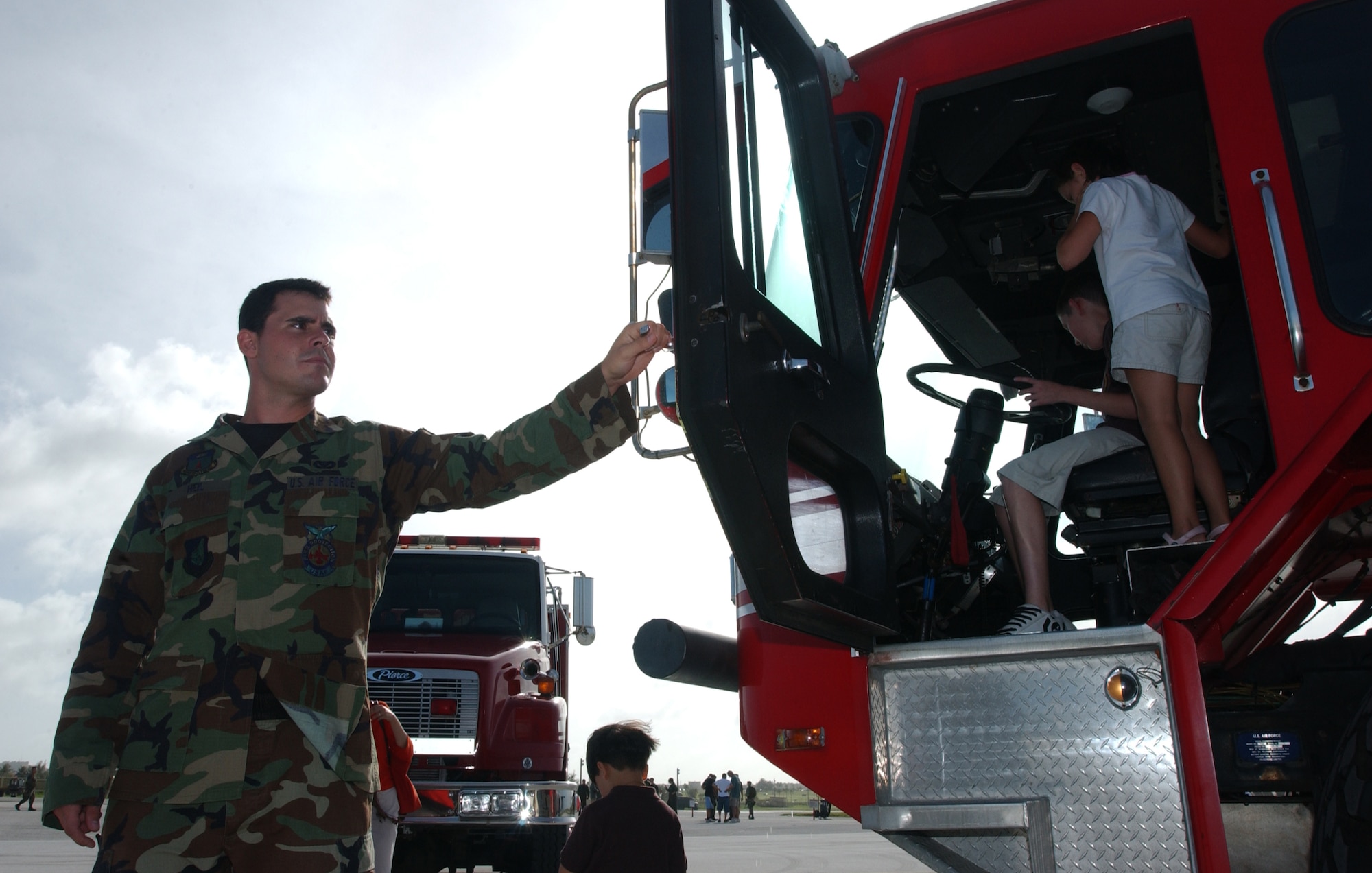 While it’s common for many children to imagine driving a fire truck, it’s not common to actually be able to sit inside one and ensure the siren is in good working order. Andersen’s fire protection specialists allowed these kids to do that very thing at the static display event here Nov. 21. While members of the maintenance and aviation community answered questions about the aircraft, the siren from the fire truck could be heard yelping across Andersen’s airfield. (Air Force photo/Senior Airman Brian Kimball)