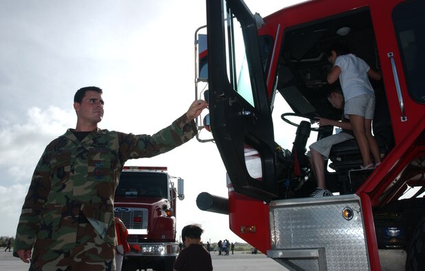 While it’s common for many children to imagine driving a fire truck, it’s not common to actually be able to sit inside one and ensure the siren is in good working order. Andersen’s fire protection specialists allowed these kids to do that very thing at the static display event here Nov. 21. While members of the maintenance and aviation community answered questions about the aircraft, the siren from the fire truck could be heard yelping across Andersen’s airfield. (U.S. Air Force photo/Senior Airman Brian Kimball)