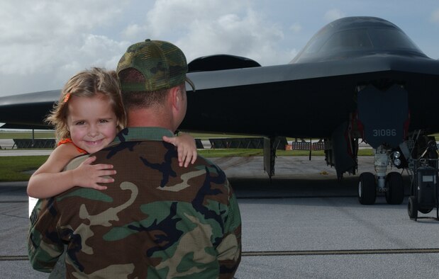 Riley Holland and her father, Staff Sgt. Blaine Holland, 36th Civil Engineer Squadron, venture out and enjoy the aircraft static displays Nov. 21. The aviation community opened its doors for military members and their families to view the operational mission here up close. The event was covered by local TV media and was supported by the fire department, maintenance personnel and security forces. (U.S. Air Force photo/Senior Airman Brian Kimball)