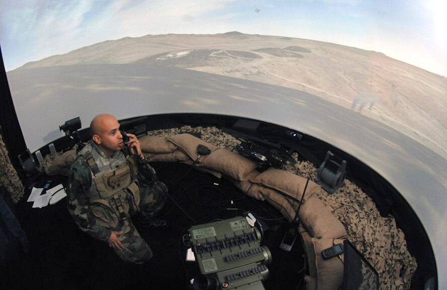 Staff Sgt. Dennis Krouse calls in close-air support Nov. 28 during a simulation at the Interservice/Industry Training, Simulation and Education Conference in Orlando, Fla. Sergeant Krouse is a joint terminal attack controller stationed at Fort Hood, Texas. (U.S. Air Force photo/Tech. Sgt. Larry A. Simmons)