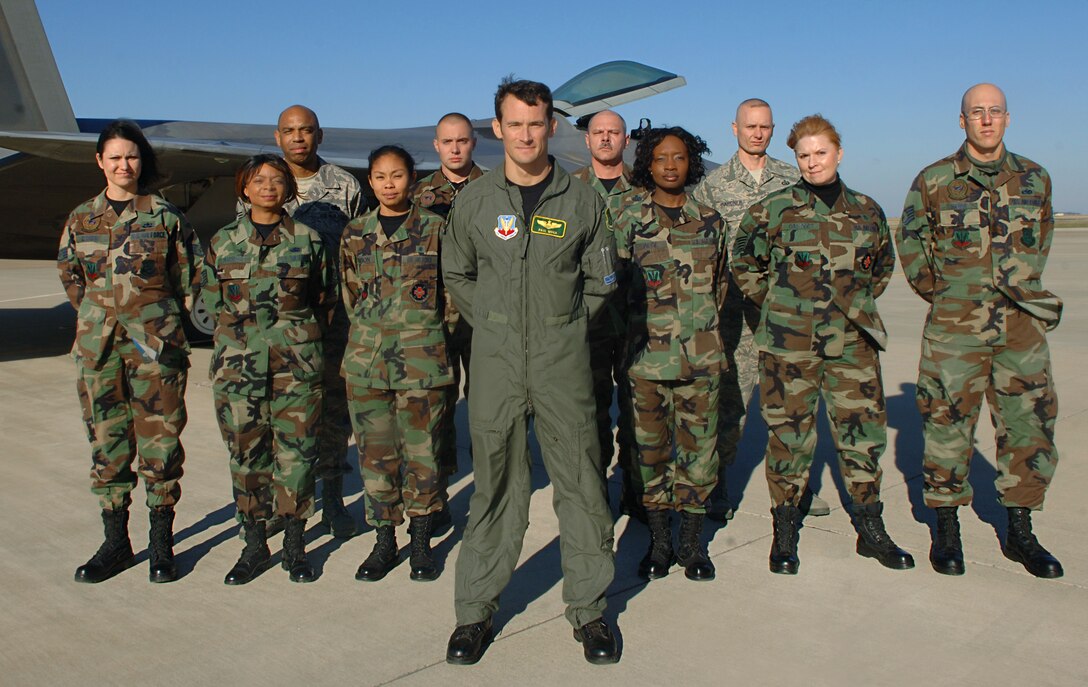 LANGLEY AIR FORCE BASE, Va. -- The F-22 Demonstration Team marked the end of its first air show season by hosting a re-enlistment ceremony for 10 Airmen followed by a demonstration Nov. 29.  (U.S. Air Force photo/Airman 1st Class Vernon Young.)