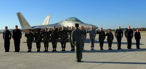 LANGLEY AIR FORCE BASE, Va. -- The F-22 Demonstration Team marked the end of its first air show season by hosting a re-enlistment ceremony for 10 Airmen followed by a demonstration Nov. 29.  (U.S. Air Force photo/Airman 1st Class Vernon Young.)
