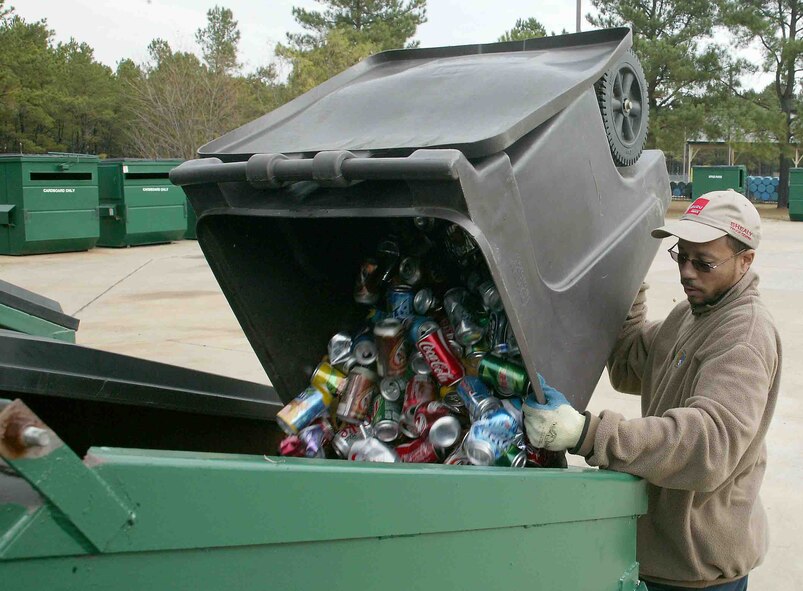 SHAW AIR FORCE BASE, S.C. -- Dana Green, Shaw's recycle center attendant, sorts and cleans the many bins at the recycling center Nov. 27. Shaw recycles aluminum cans, plastic and glass bottles, office paper, newspaper, magazines, cardboard, printer cartridges, shoes and metals. (U.S. Air Force photo/Staff Sgt. John Gordinier)