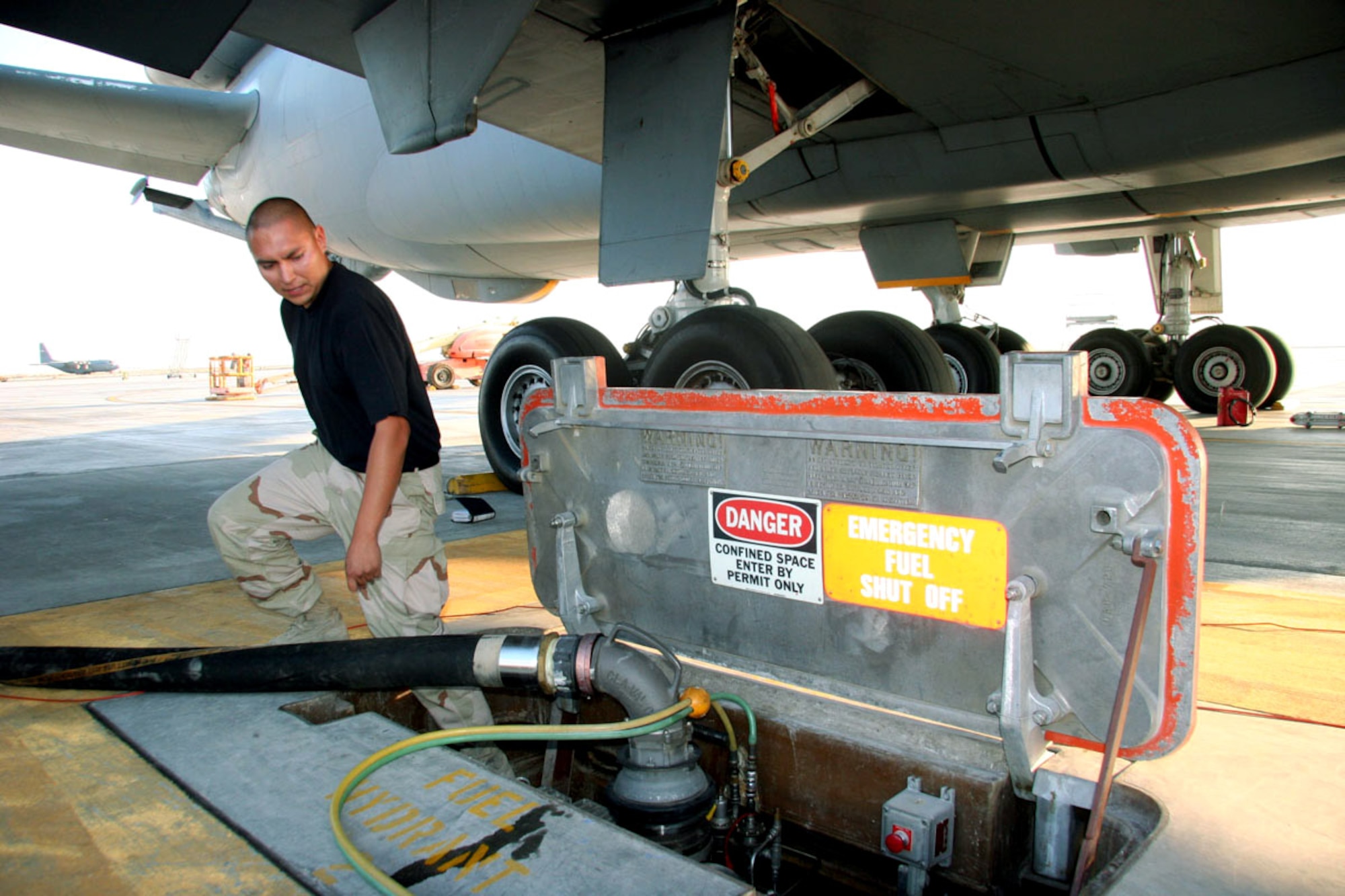 Senior Airman Shiloh White Hawk, 380th Expeditionary Logistics Readiness Squadron, fuels distribution technician drives a R12 HSV hydrant servicing vehicle to the 380th Air Expeditionary Wing ramp to refuel a KC-10 aircraft using they underground hydrant fuel system. (U.S. Air Force photo/Master Sgt. Ruby Zarzyczny)