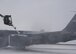 KC-135 Stratotanker gets prepared for an exercise mission by a deicer on the flight line at Grand Forks Air Force Base, North Dakota on November 28, 2007. The base is undergoing a strategic exercise in the -12 degree weather, -20 degree wind chill, a typical North Dakota day in the winter months. (U.S. Air Force photo/Senior Airman Chad M. Kellum)